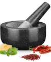 The H&S Granite Mortar and Pestle Set is crafted with convenience in mind. The dimensions of the mortar are 16cm (6.3") in diameter and 8cm (3.15") in height, while the interior bowl measures 12cm (4.7") in diameter and 6cm (2.4") in depth.