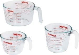 The Pyrex Glass Measuring Cup Set comprises three essential pieces: a 1-cup, 2-cup, and 4-cup measuring cup, each meticulously designed to cater to various culinary needs.